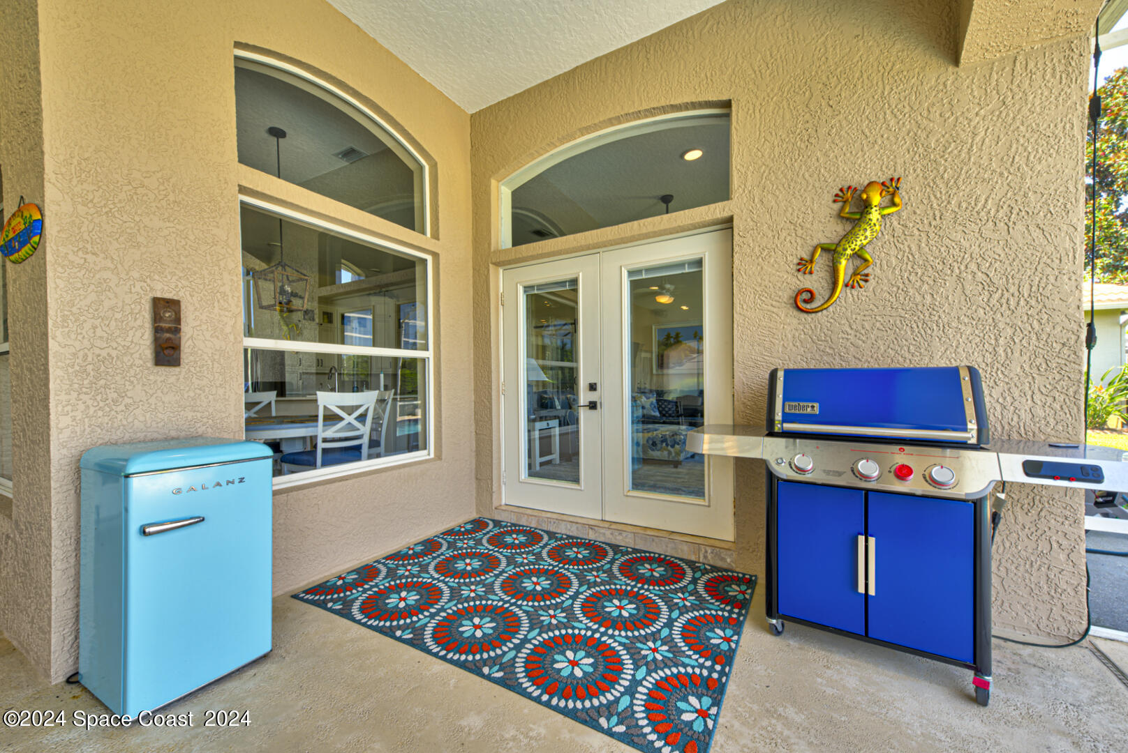 4070 Stoney Point Road Melbourne, FL 32940 - Photo 63 of 75 a bedroom with a bed and a dresser in it