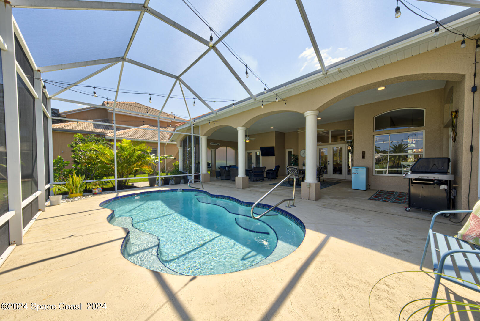 4070 Stoney Point Road Melbourne, FL 32940 - Photo 67 of 75 a view of a swimming pool with outdoor seating