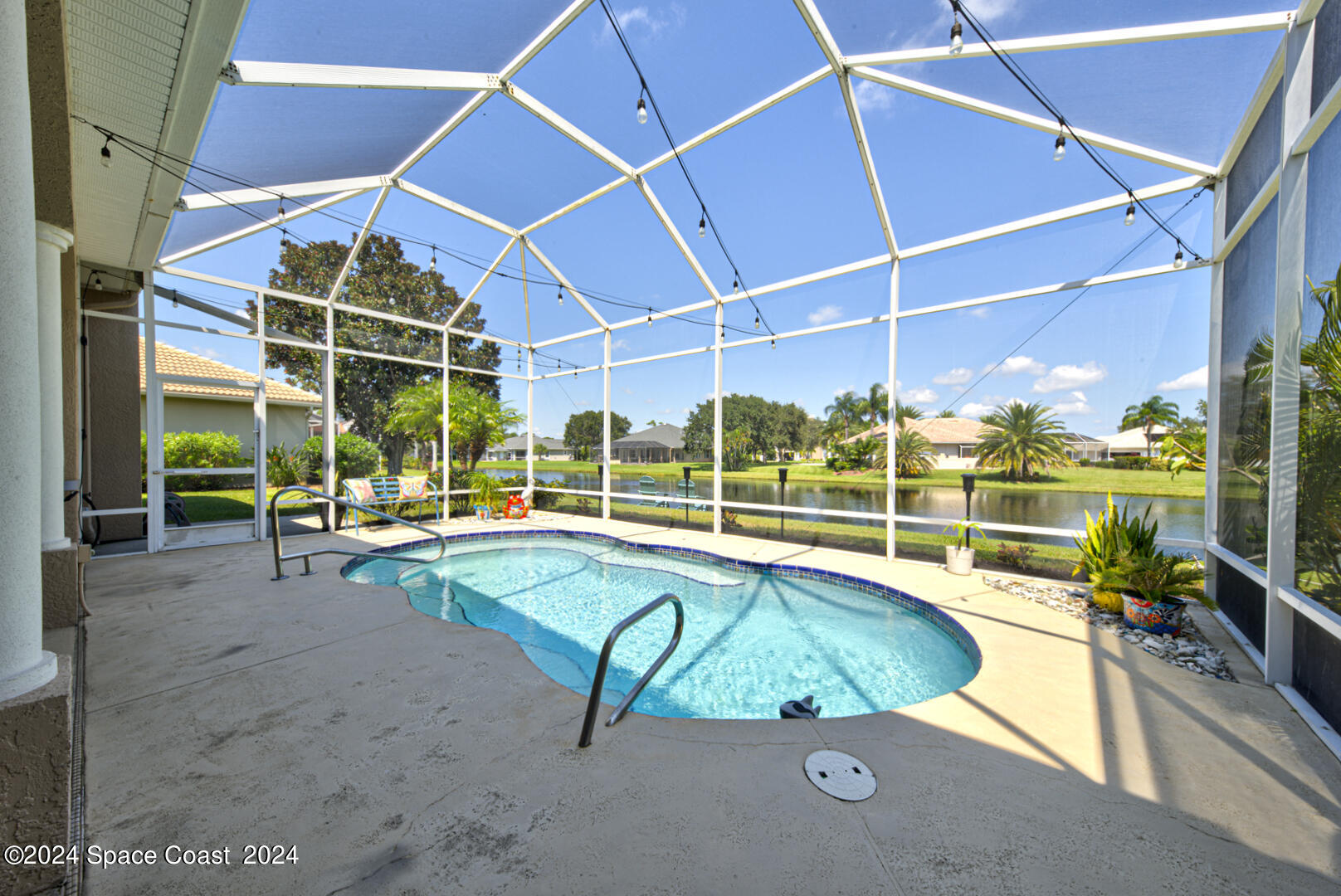 4070 Stoney Point Road Melbourne, FL 32940 - Photo 68 of 75 a view of a swimming pool with a yard