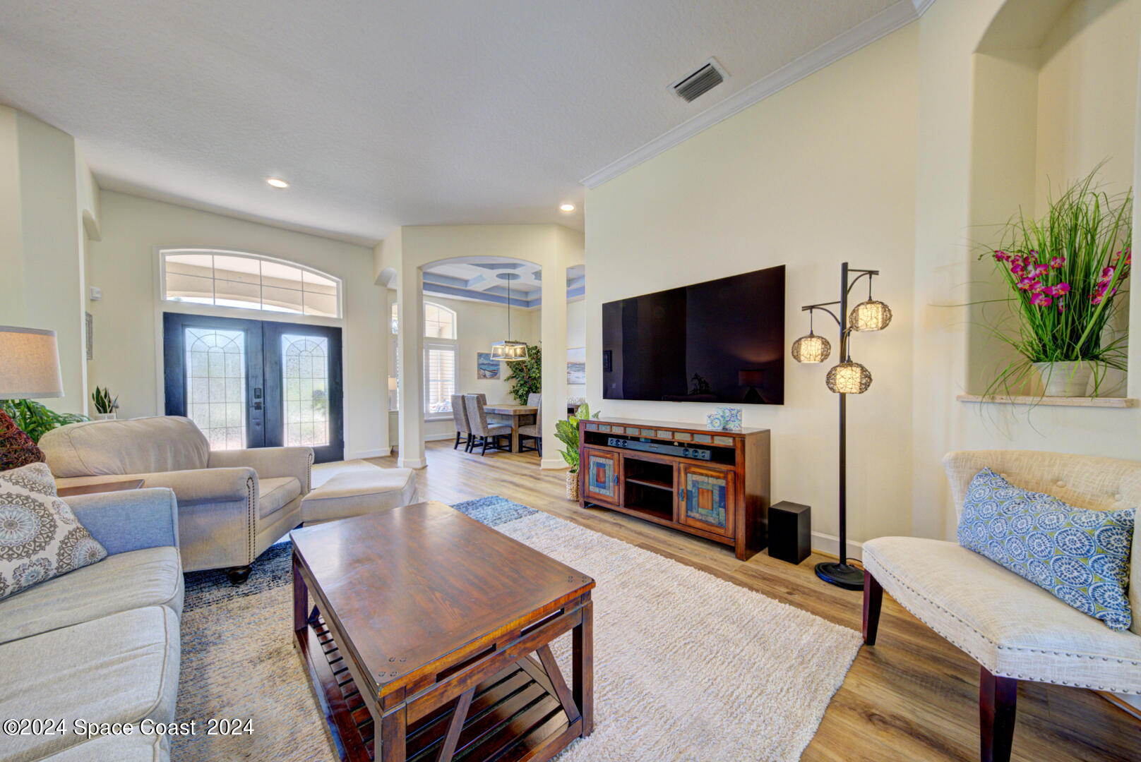 4070 Stoney Point Road Melbourne, FL 32940 - Photo 7 of 75 a living room with furniture and a flat screen tv