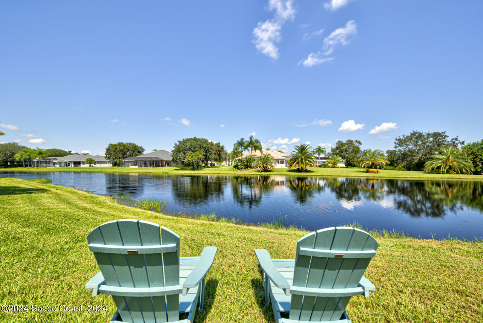 4070 Stoney Point Road Melbourne, FL 32940 - Photo 71 of 75 a view of a lake with a house swimming pool and outdoor space