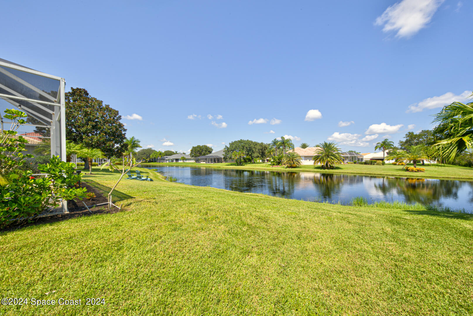 4070 Stoney Point Road Melbourne, FL 32940 - Photo 74 of 75 a view of a lake with a house in the background