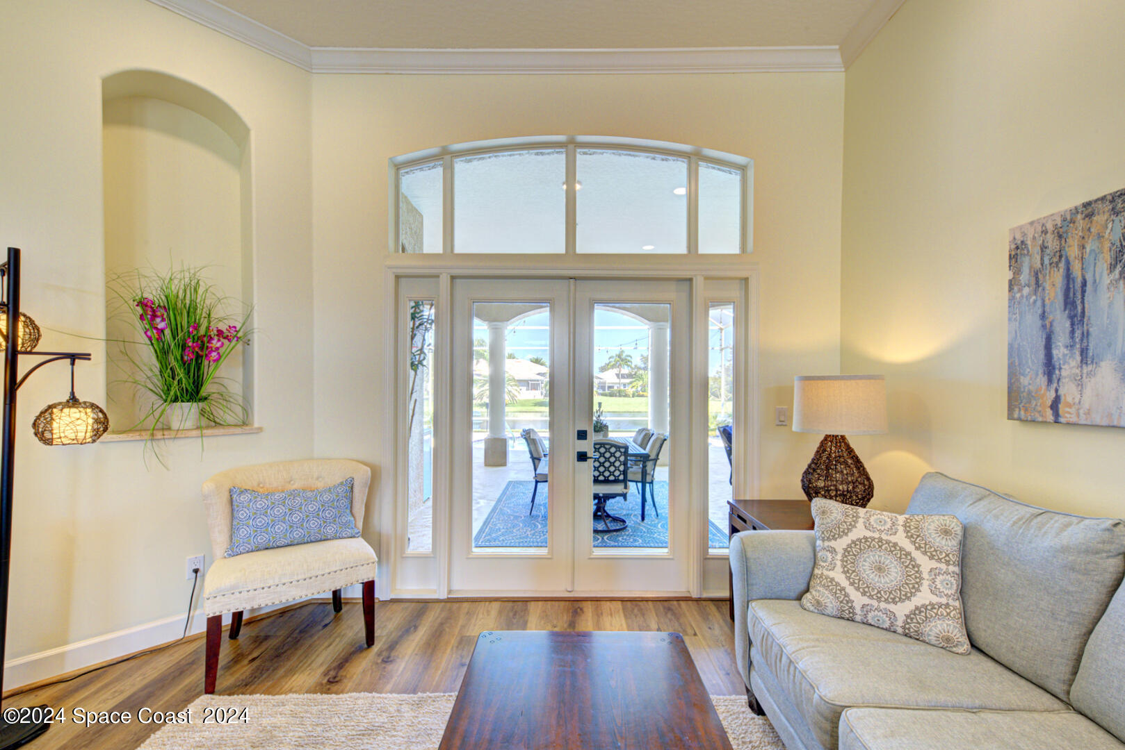 4070 Stoney Point Road Melbourne, FL 32940 - Photo 8 of 75 a living room with furniture and wooden floor