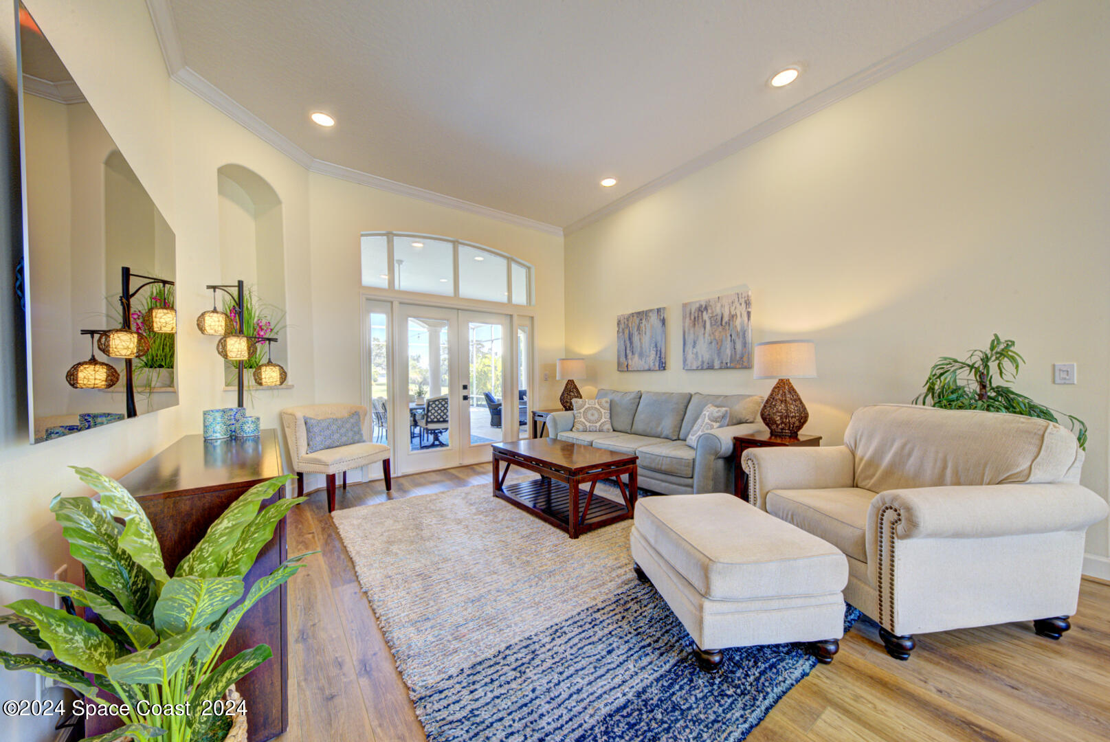 4070 Stoney Point Road Melbourne, FL 32940 - Photo 9 of 75 a living room with furniture and a large window