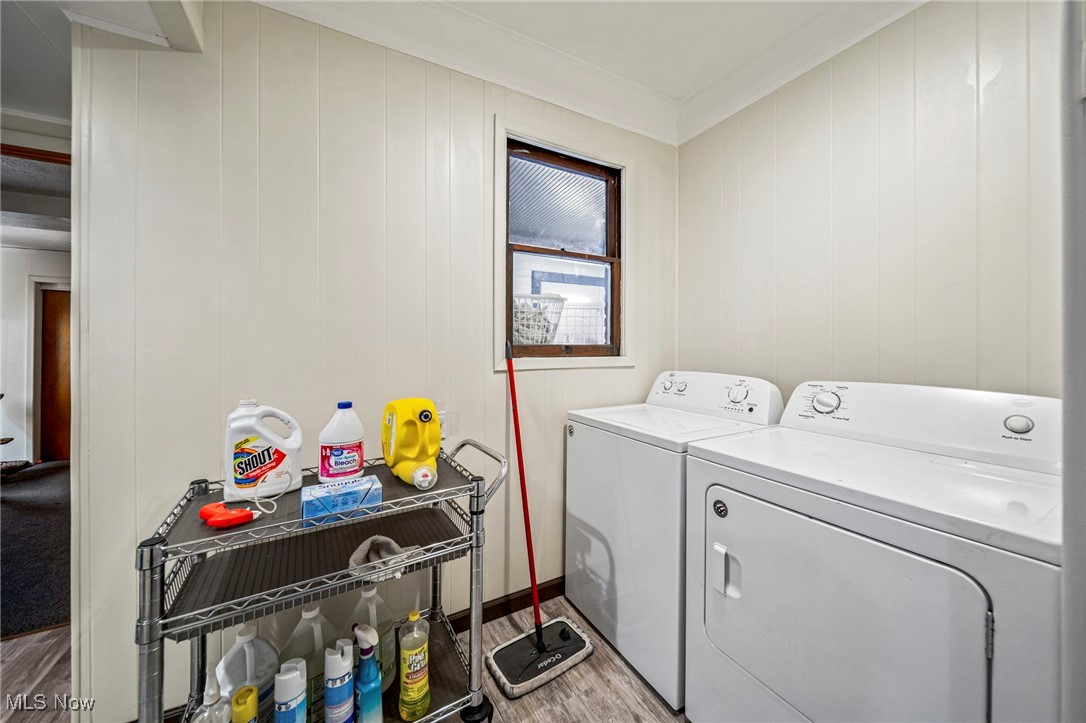 977 West Prospect Road Ashtabula, OH 44004 - Photo 20 of 42 Washroom featuring light wood-type flooring and separate washer and dryer