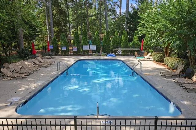 a view of swimming pool with a patio