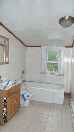 417 County Road Rochester, MA 02576 - Photo 5 of 11 a bathroom with a sink a toilet and bathtub