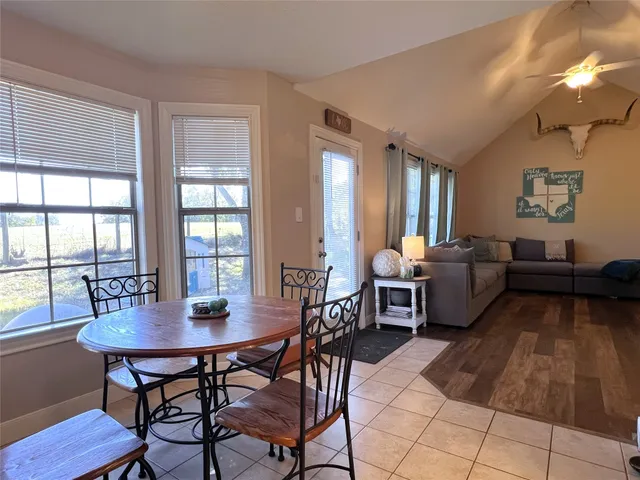 a view of a dining room with furniture and window