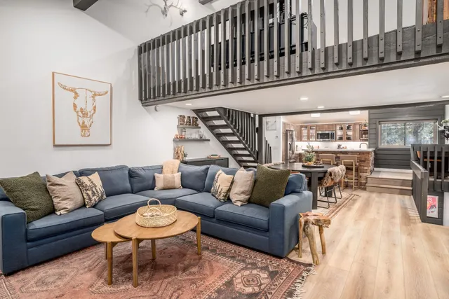 a living room with furniture and a rug
