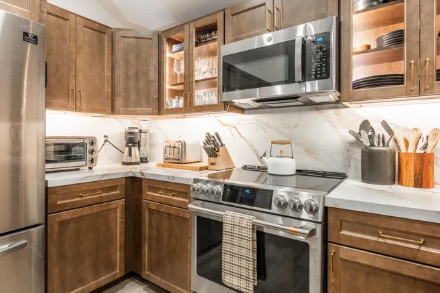 a kitchen with a sink and a stove top oven