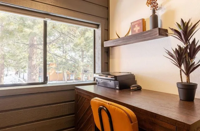 a dining room with furniture and a chandelier