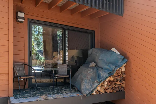 a view of a brick house with a large window