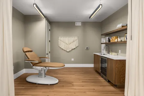 a dining room with furniture and window