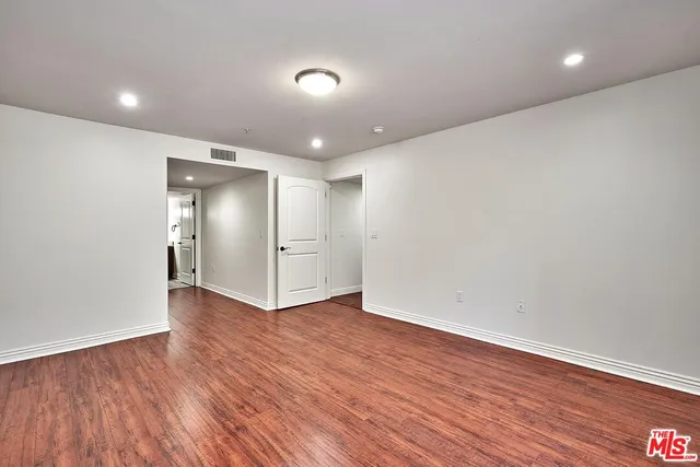 a bathroom with a shower and a sink