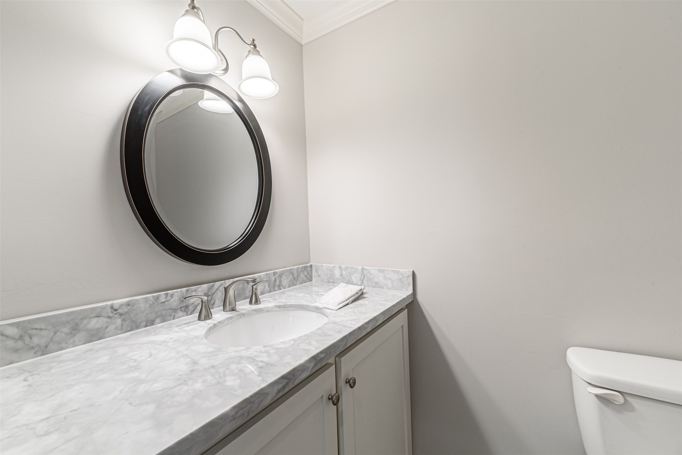 701 Bering Drive, Unit 1901 Houston, TX 77057 - Photo 12 of 29 a bathroom with a granite countertop sink and a mirror