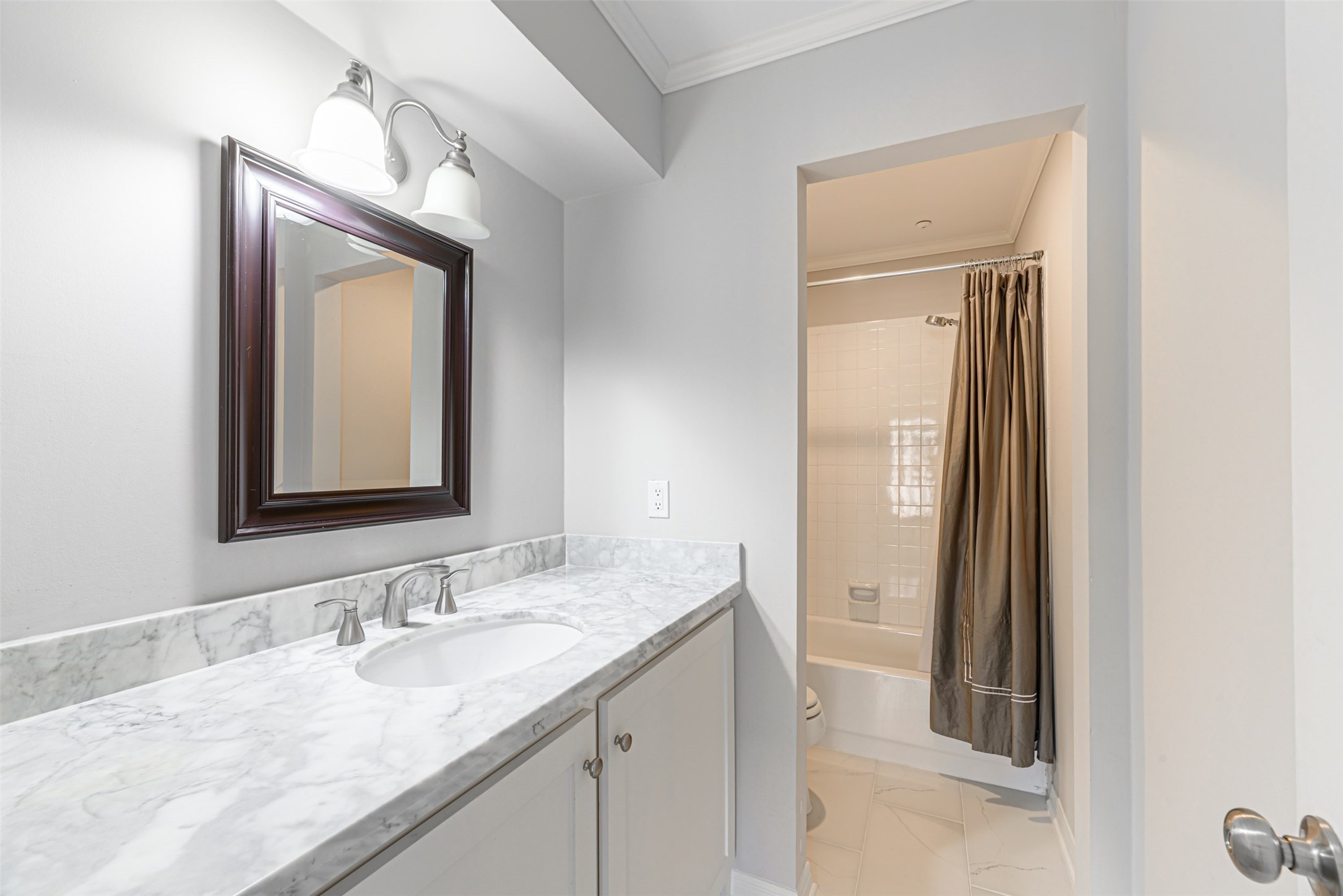 701 Bering Drive, Unit 1901 Houston, TX 77057 - Photo 16 of 29 a bathroom with a granite countertop sink vanity and mirror