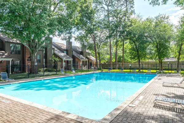 a view of a swimming pool with a backyard