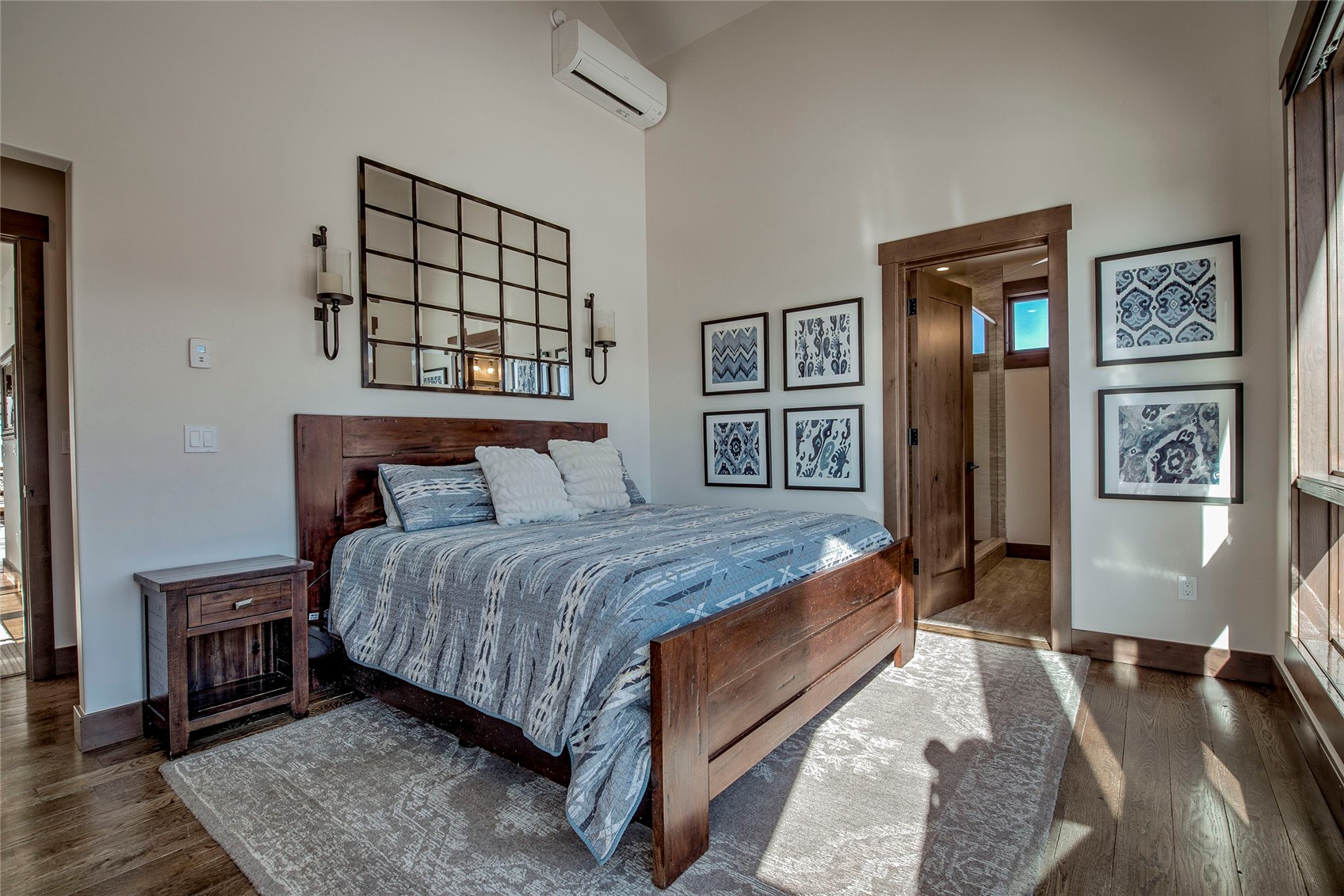 307 Maryland Creek Road Silverthorne, CO 80498 - Photo 13 of 47 Primary bedroom featuring vaulted ceilings and large windows with 270 degree mountain views