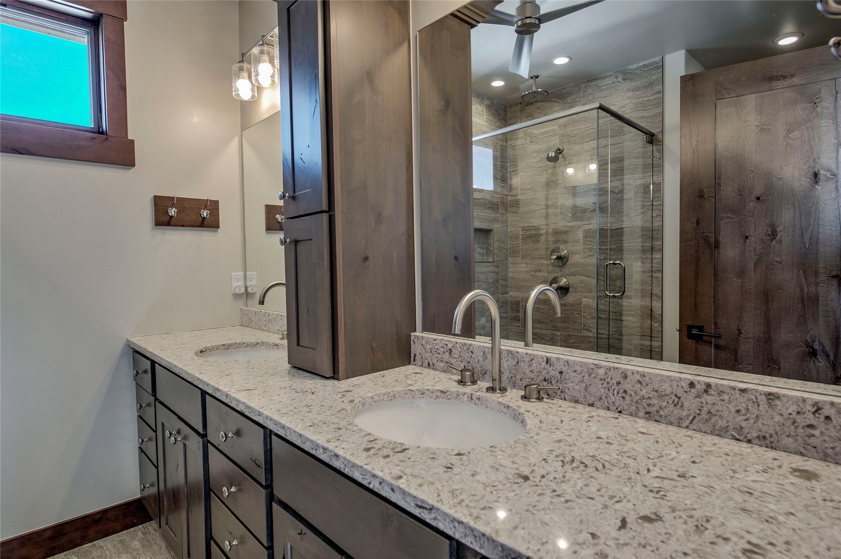307 Maryland Creek Road Silverthorne, CO 80498 - Photo 14 of 47 Bathroom with double vanity and a tiled shower