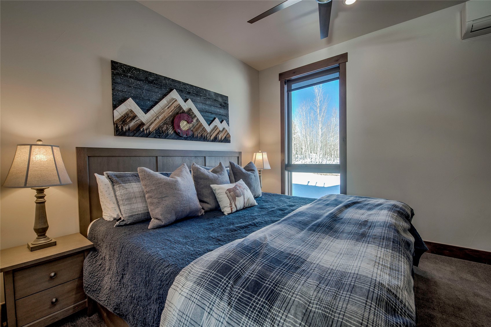 307 Maryland Creek Road Silverthorne, CO 80498 - Photo 18 of 47 Bedroom with carpet flooring, a wall mounted AC, and a ceiling fan