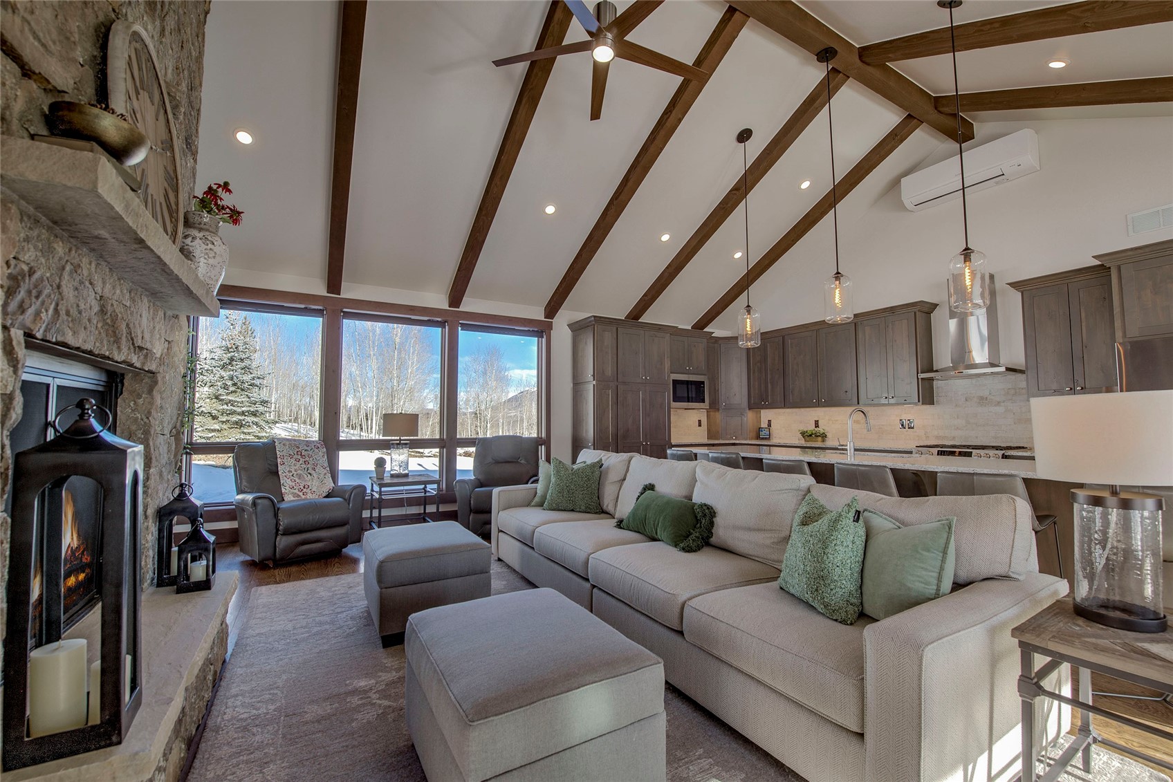 307 Maryland Creek Road Silverthorne, CO 80498 - Photo 2 of 47 Living area featuring high vaulted ceiling, a fireplace, recessed lighting, a wall unit AC, and beamed ceiling