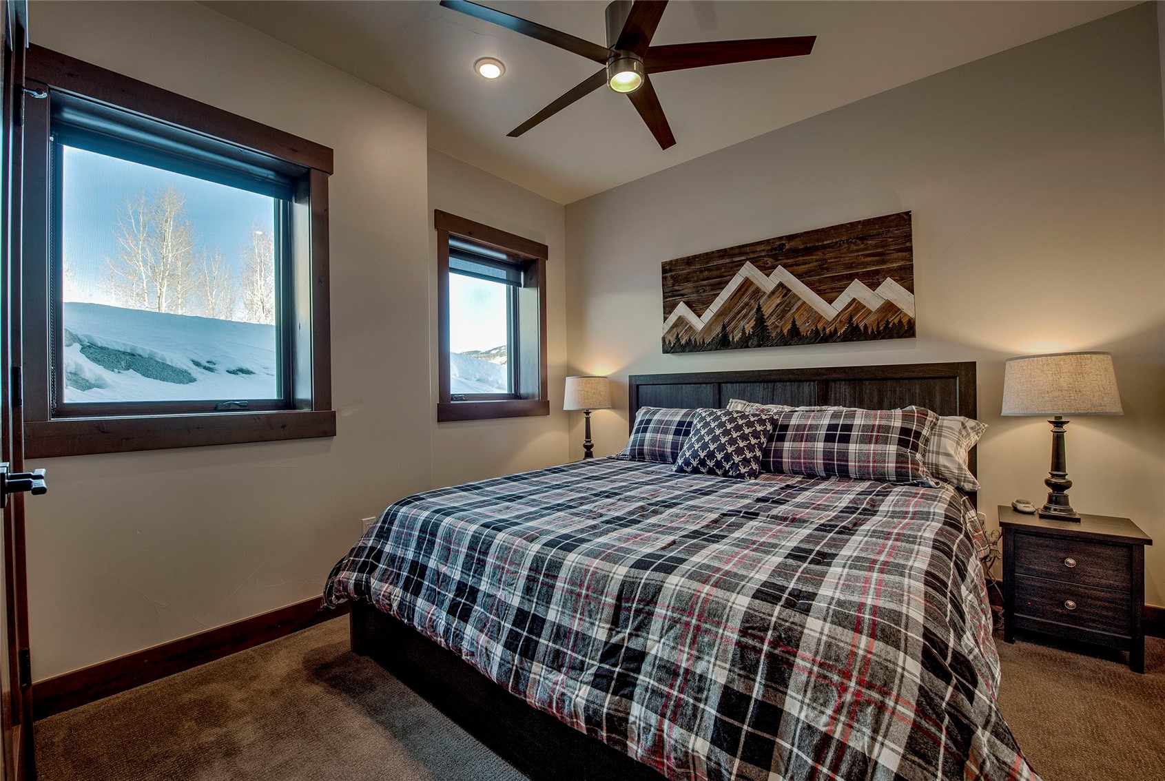307 Maryland Creek Road Silverthorne, CO 80498 - Photo 25 of 47 Bedroom featuring dark colored carpet and ceiling fan