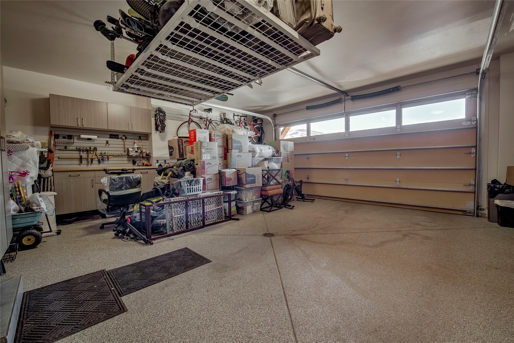 307 Maryland Creek Road Silverthorne, CO 80498 - Photo 31 of 47 Garage with epoxy floors, cabinet space, and dog wash.