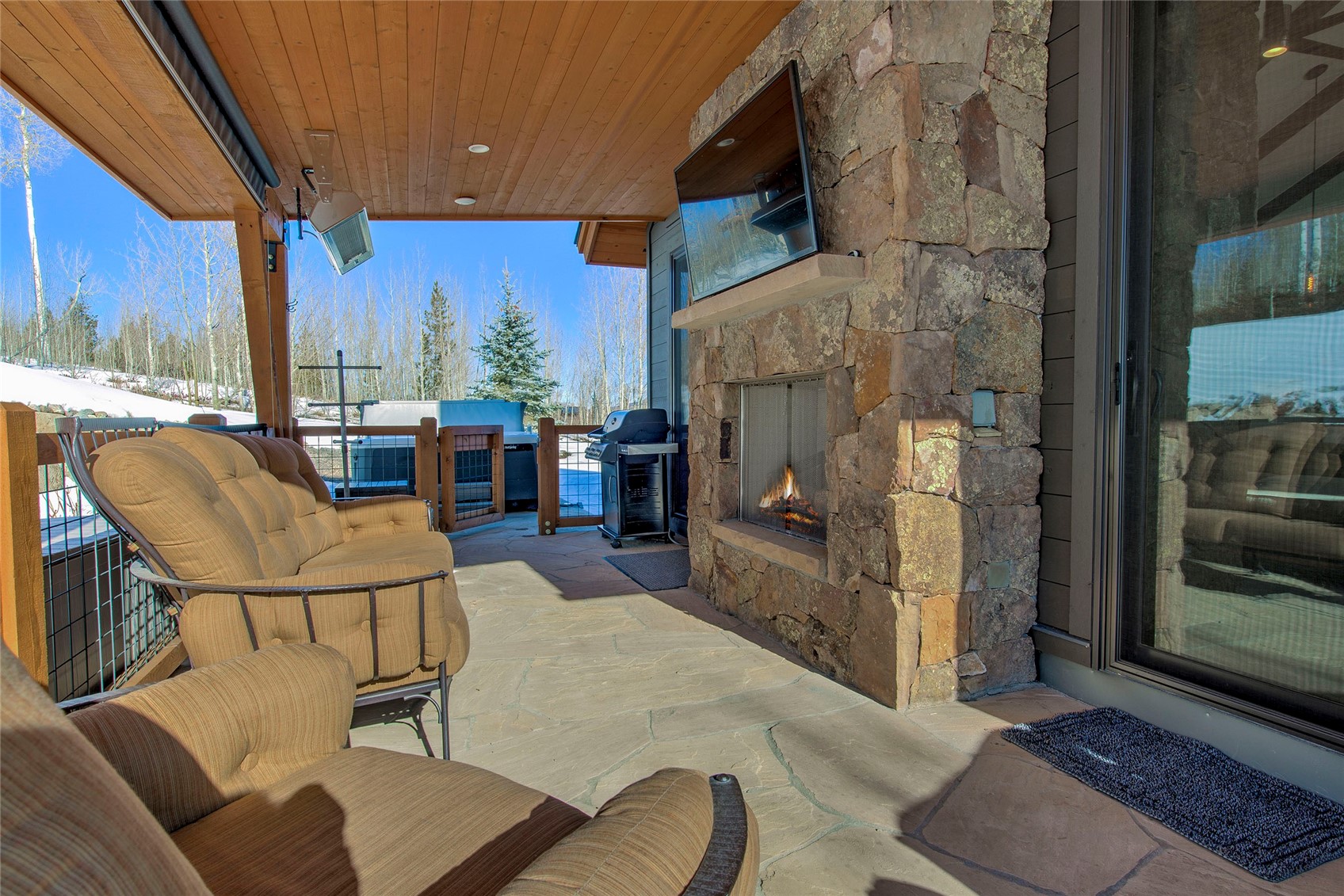 307 Maryland Creek Road Silverthorne, CO 80498 - Photo 33 of 47 View of patio / terrace featuring grilling area and an outdoor living space with a fireplace