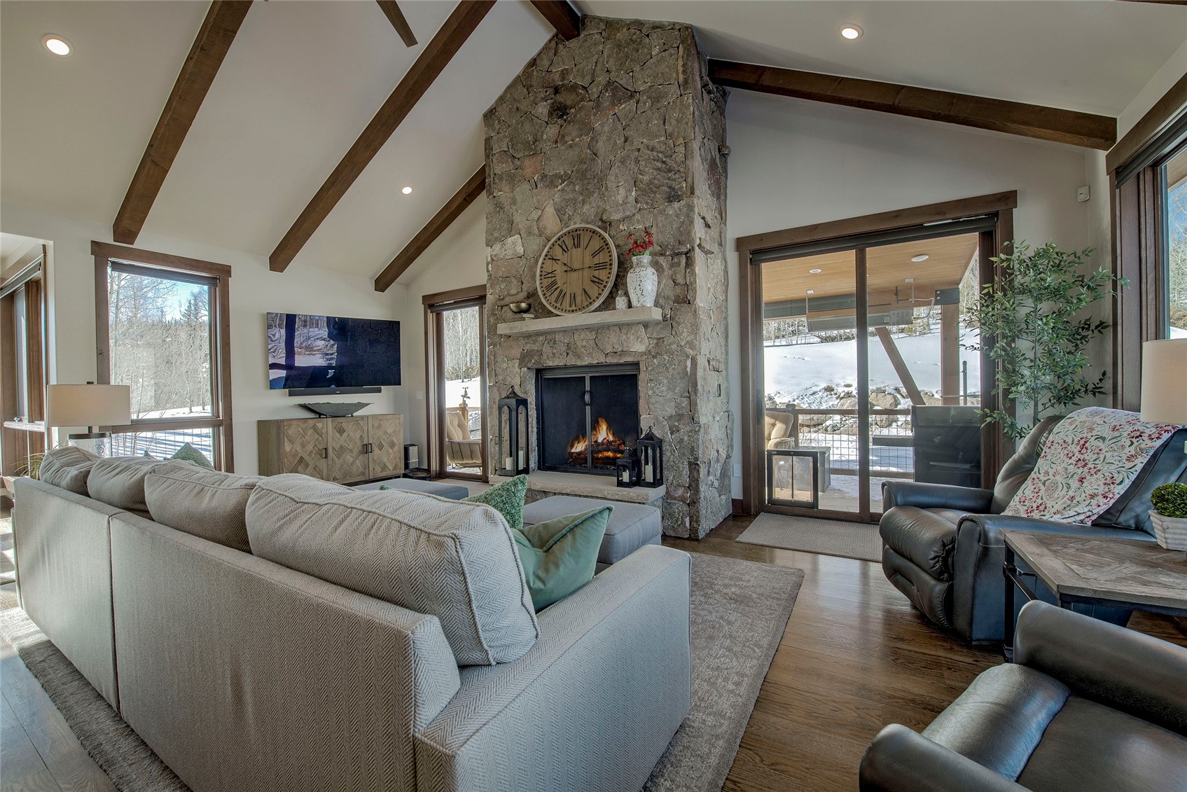 307 Maryland Creek Road Silverthorne, CO 80498 - Photo 4 of 47 Living area featuring high vaulted ceiling, a fireplace, recessed lighting, a wall unit AC, and beamed ceiling
