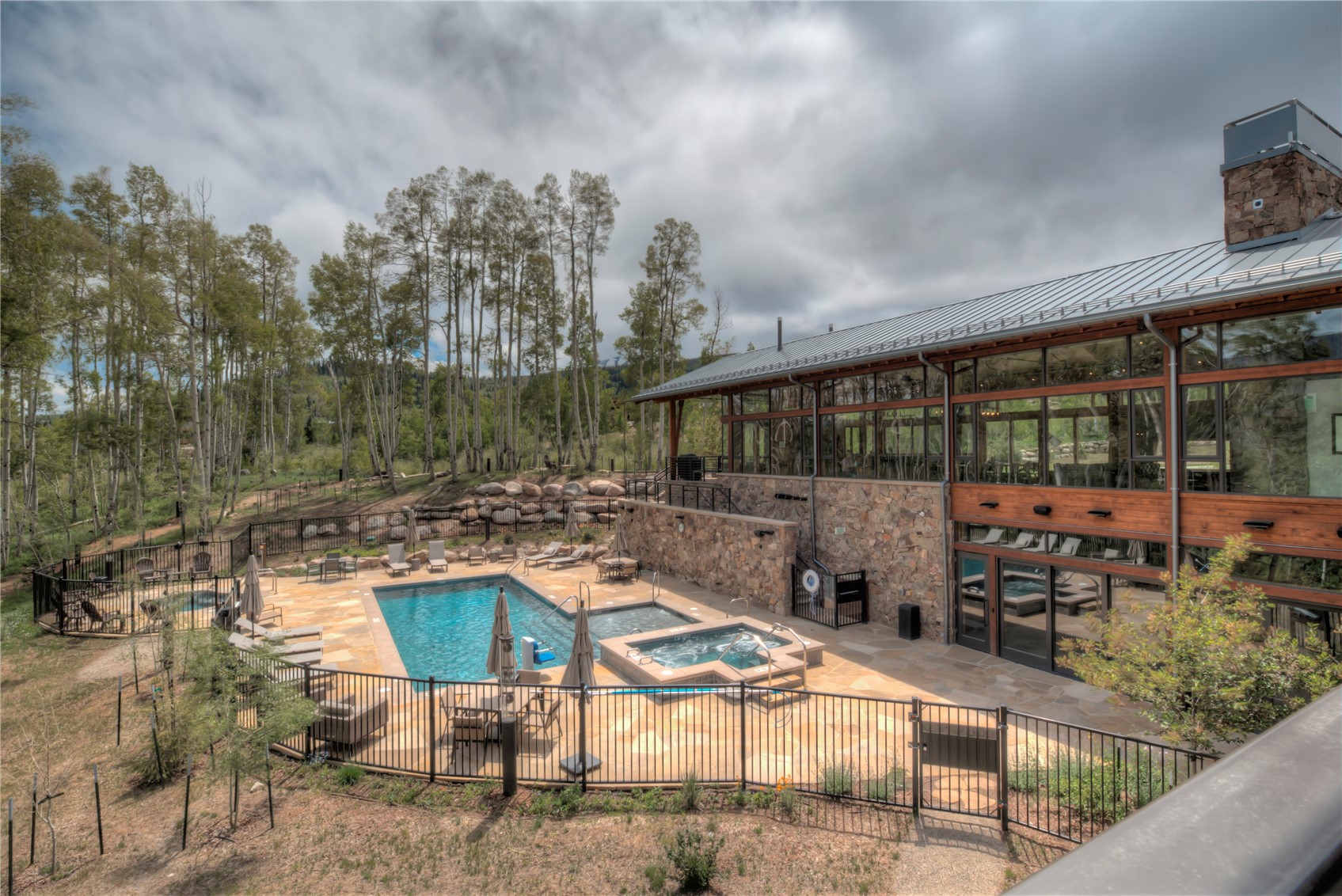 307 Maryland Creek Road Silverthorne, CO 80498 - Photo 44 of 47 Community Clubhouse, pool featuring a hot tub and a patio