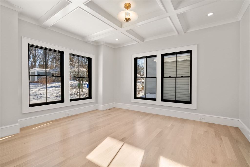 577 Grove Street Newton, MA 02462 - Photo 11 of 29 an empty room with windows and closet