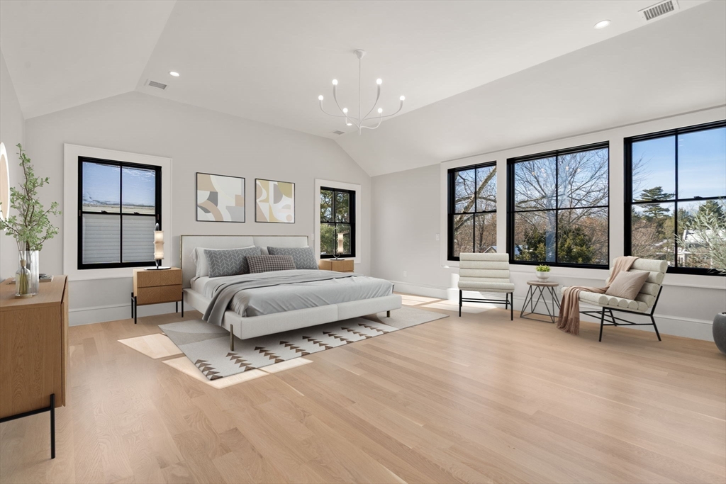 577 Grove Street Newton, MA 02462 - Photo 13 of 29 a spacious bedroom with a bed and a large window
