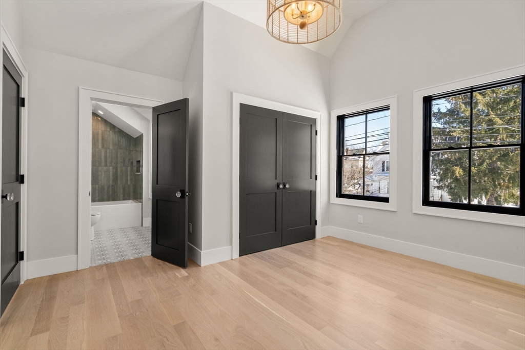 577 Grove Street Newton, MA 02462 - Photo 16 of 29 a big room with windows and closet