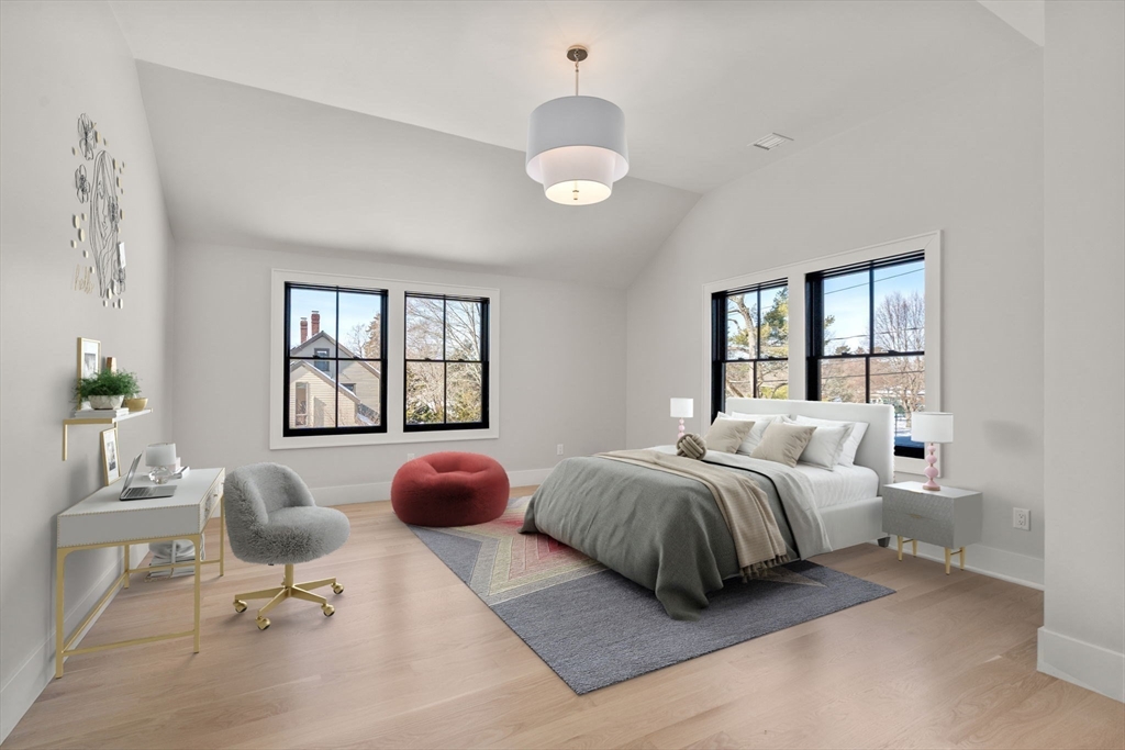577 Grove Street Newton, MA 02462 - Photo 21 of 29 a bedroom with bed and glass windows