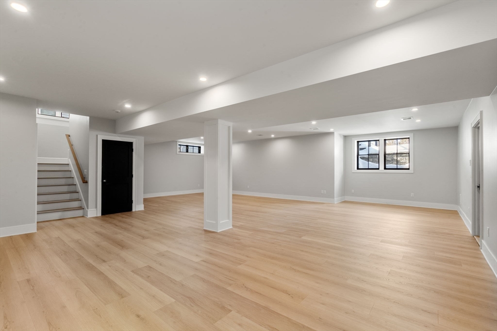 577 Grove Street Newton, MA 02462 - Photo 25 of 29 a view of an empty room with wooden floor and a window