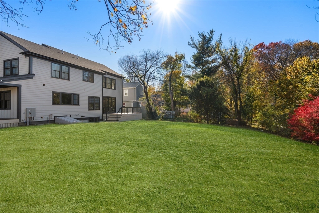 577 Grove Street Newton, MA 02462 - Photo 26 of 29 a view of a house with backyard and garden