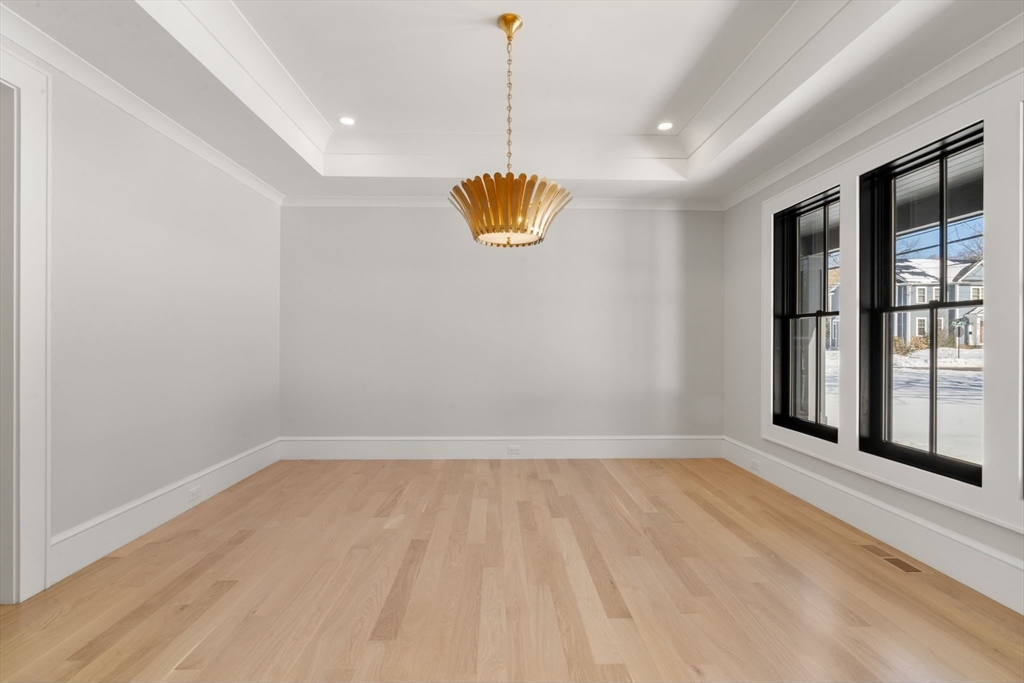 577 Grove Street Newton, MA 02462 - Photo 8 of 29 a view of an empty room with a window