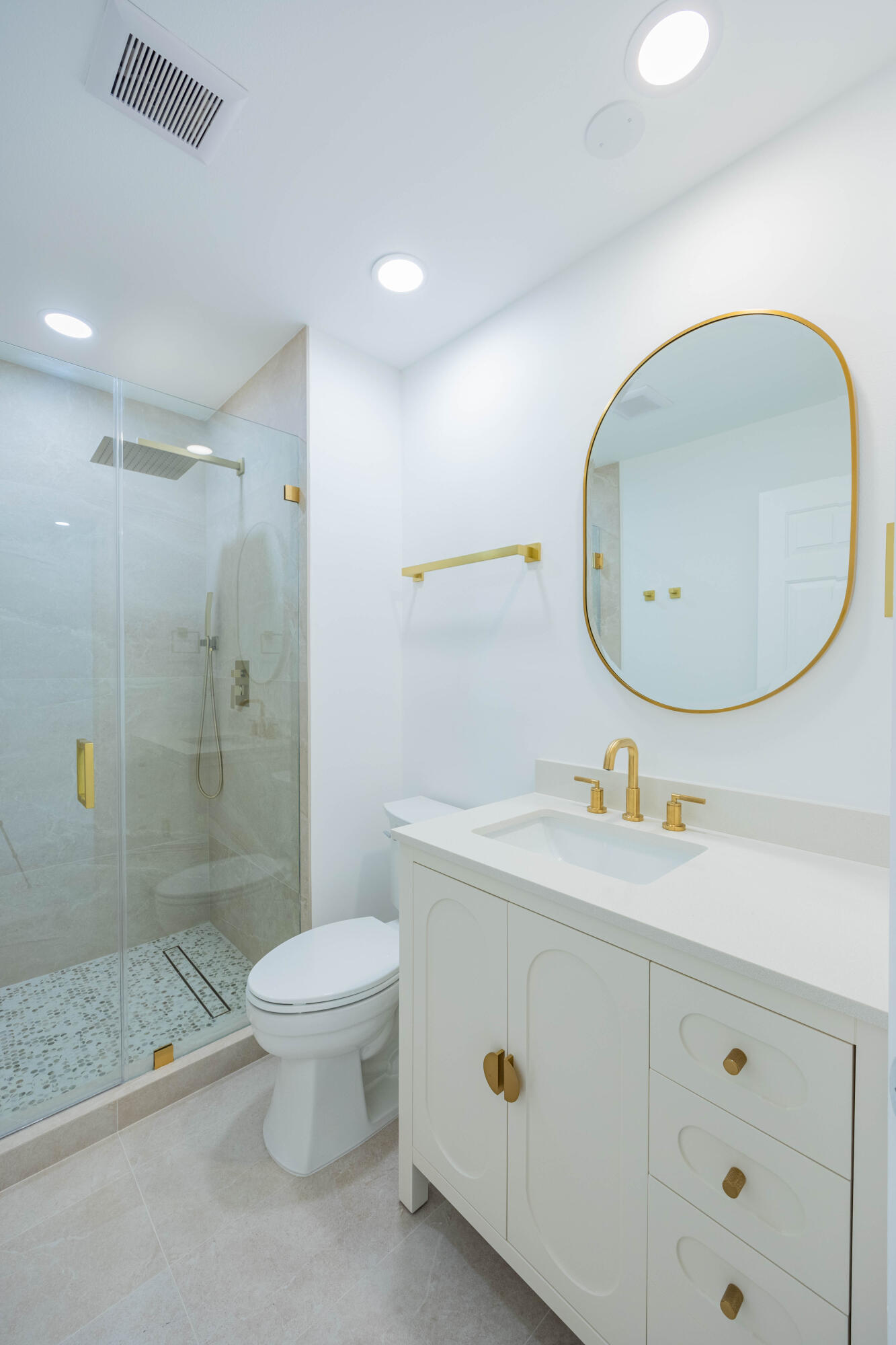 7520 La Paz Boulevard, Unit 104 Boca Raton, FL 33433 - Photo 36 of 56 a bathroom with a sink mirror toilet and shower