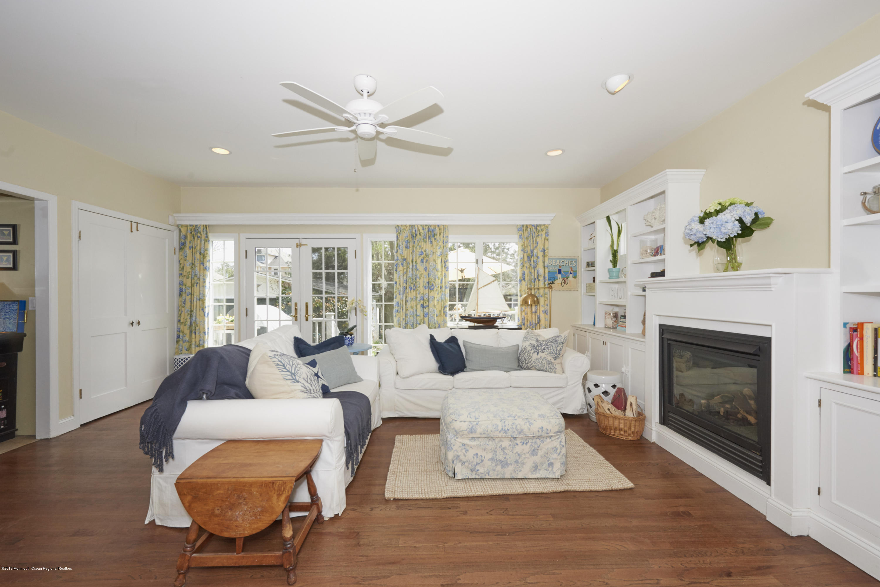 117 Black Point Road Rumson, NJ 07760 - Photo 14 of 34 a living room with furniture a fireplace and wooden floor