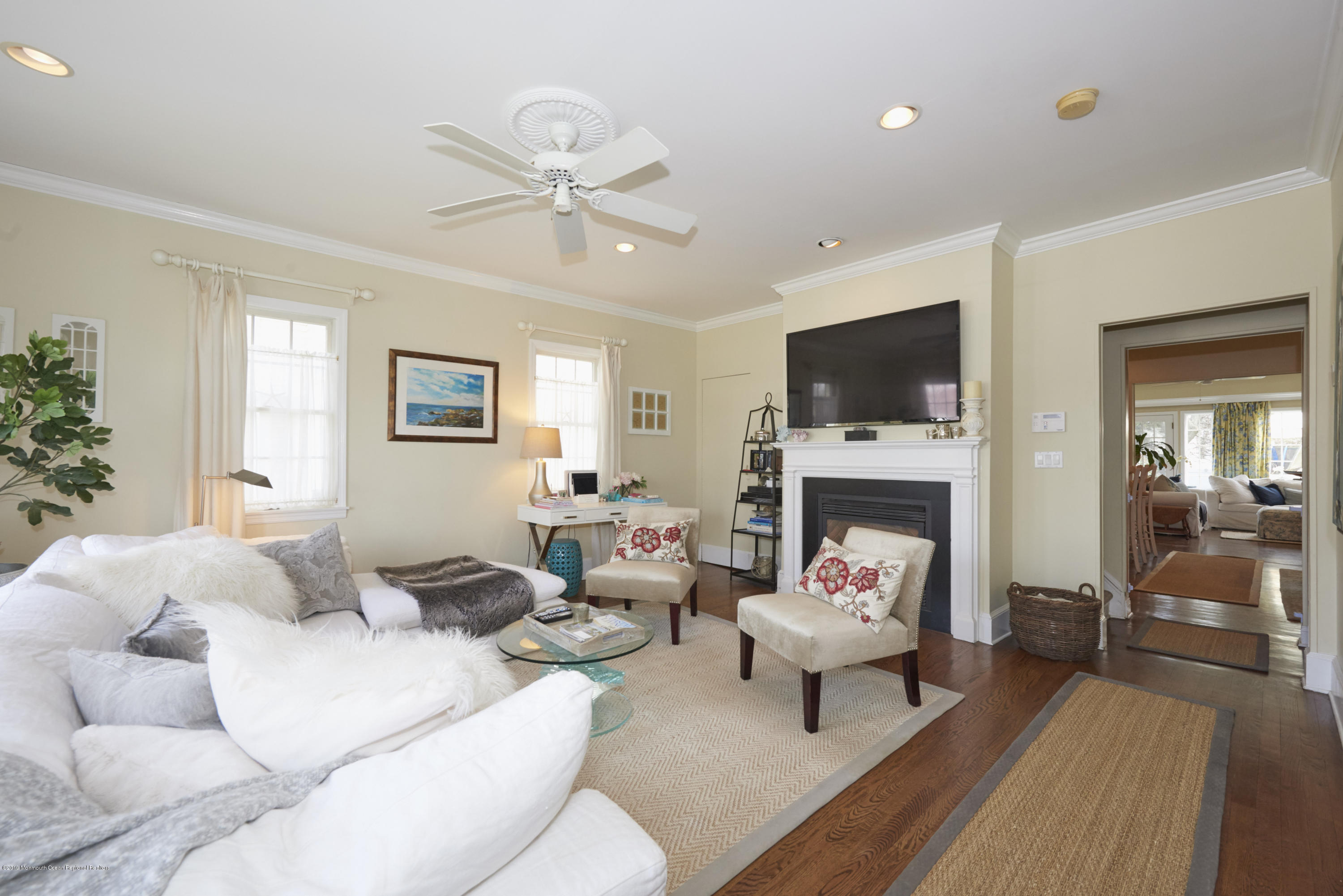 117 Black Point Road Rumson, NJ 07760 - Photo 3 of 34 a living room with furniture a fireplace and a flat screen tv
