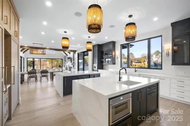 a kitchen with stainless steel appliances granite countertop a stove and a sink