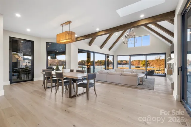 a dining room with furniture and wooden floor