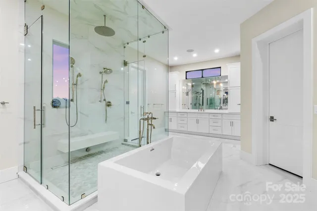 a bathroom with a shower sink and mirror