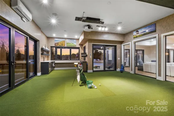 a large kitchen with kitchen island a table and chairs