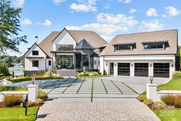 a view of a house with swimming pool and sitting area