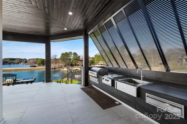 a building outdoor space with patio furniture and potted plants