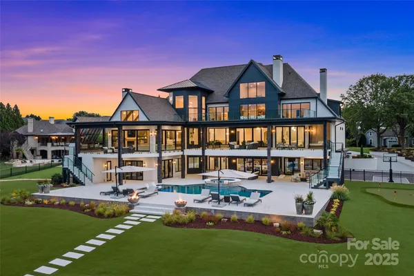 a view of a swimming pool and lounge chairs