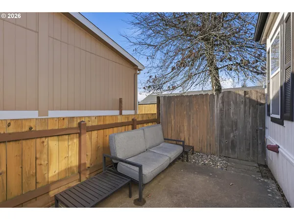 a view of a backyard with a sitting area