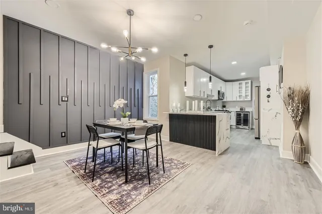 a dining room with furniture and window