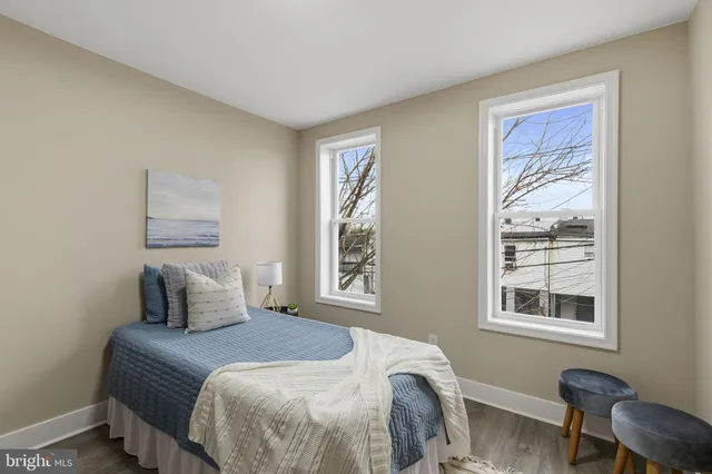 a bedroom with a bed and a lamp